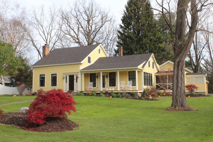 roofing contractors near rome ny image of house and lawn with replacement roof from van derhoof roofers